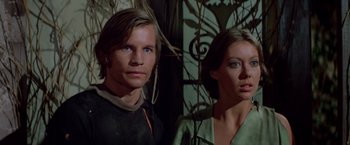 Movie still from “Logan's Run” (1976), directed by Michael Anderson – A man and a woman standing next to each other; Close Up shot, Low angle