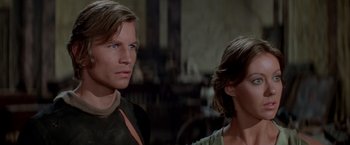 Movie still from “Logan's Run” (1976), directed by Michael Anderson – A man and a woman standing next to each other; Close Up shot, Low angle