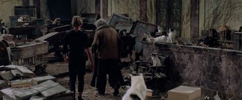 Movie still from “Logan's Run” (1976), directed by Michael Anderson – A couple of people standing next to a bunch of cats; Wide shot, High angle