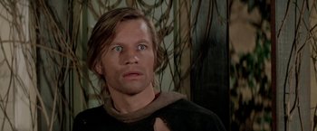 Movie still from “Logan's Run” (1976), directed by Michael Anderson – A person with long brown hair; Close Up shot, Low angle