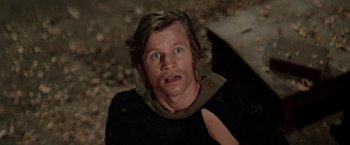 Movie still from “Logan's Run” (1976), directed by Michael Anderson – A person wearing a black shirt; Close Up shot, Low angle