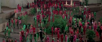 Movie still from “Logan's Run” (1976), directed by Michael Anderson – A group of people dressed in red and green; Extreme Wide shot, High angle
