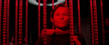 Movie still from “Logan's Run” (1976), directed by Michael Anderson – A woman standing in front of a red light; Close Up shot, Low angle