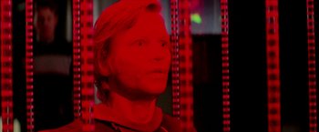 Movie still from “Logan's Run” (1976), directed by Michael Anderson – A man with blonde hair is looking into the distance; Close Up shot, Low angle