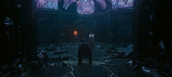 Movie still from “Loki” (2021), created by Michael Waldron – A man and a woman are standing in a room; Wide shot, High angle