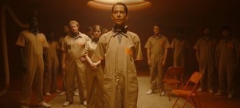 Movie still from “Loki” (2021), created by Michael Waldron – A group of people standing in a room; Medium shot, Low angle