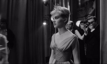 Movie still from “Lolita” (1962), directed by Stanley Kubrick – A black and white photo of a woman in a tiara; Medium shot, Low angle