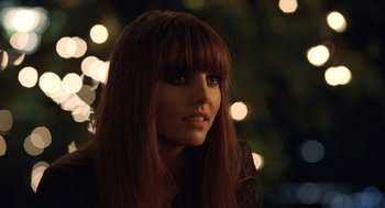 Movie still from “London Boulevard” (2010), directed by William Monahan – A person with long brown hair; Close Up shot, Over the shoulder angle