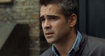 Movie still from “London Boulevard” (2010), directed by William Monahan – A person wearing a jacket and looking to his left; Close Up shot, Over the shoulder angle