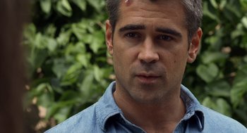 Movie still from “London Boulevard” (2010), directed by William Monahan – A person wearing a blue shirt; Close Up shot, Over the shoulder angle