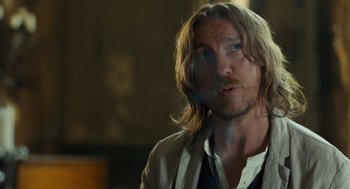 Movie still from “London Boulevard” (2010), directed by William Monahan – A person with long blonde hair; Close Up shot, Over the shoulder angle