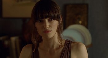 Movie still from “London Boulevard” (2010), directed by William Monahan – A person wearing a brown shirt; Close Up shot, Over the shoulder angle