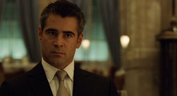 Movie still from “London Boulevard” (2010), directed by William Monahan – A person wearing a suit and tie; Close Up shot, Over the shoulder angle