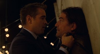 Movie still from “London Boulevard” (2010), directed by William Monahan – Two men in business suits looking at each other; Close Up shot, Over the shoulder angle