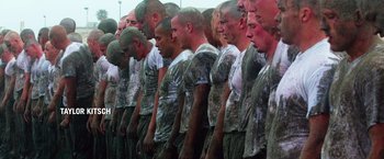 Movie still from “Lone Survivor” (2013), directed by Peter Berg – A group of men standing next to each other in camouflage shirts; Medium shot, High angle