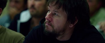 Movie still from “Lone Survivor” (2013), directed by Peter Berg – A person with a beard; Close Up shot, Over the shoulder angle