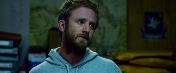 Movie still from “Lone Survivor” (2013), directed by Peter Berg – A person with a beard; Close Up shot, Over the shoulder angle