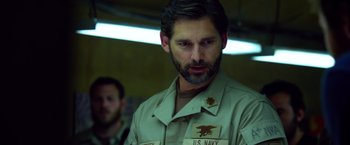 Movie still from “Lone Survivor” (2013), directed by Peter Berg – A person wearing a military uniform; Close Up shot, Over the shoulder angle