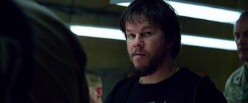 Movie still from “Lone Survivor” (2013), directed by Peter Berg – A person with a beard; Close Up shot, Over the shoulder angle