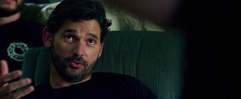 Movie still from “Lone Survivor” (2013), directed by Peter Berg – A person sitting on a couch; Close Up shot, Over the shoulder angle