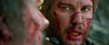 A person with blood all over his face
