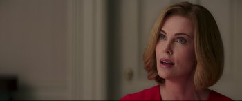 Movie still from “Long Shot” (2019), directed by Jonathan Levine – A person with short blonde hair; Close Up shot, Over the shoulder angle