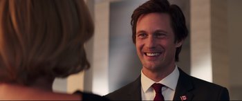 Movie still from “Long Shot” (2019), directed by Jonathan Levine – A man wearing a suit and tie smiling at a woman; Close Up shot, Over the shoulder angle