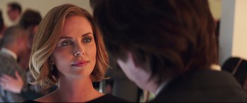 Movie still from “Long Shot” (2019), directed by Jonathan Levine – A person looking at a mirror; Close Up shot, Over the shoulder angle