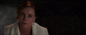 Movie still from “Long Shot” (2019), directed by Jonathan Levine – A person wearing a white jacket; Close Up shot, Over the shoulder angle