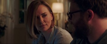 Movie still from “Long Shot” (2019), directed by Jonathan Levine – A person sitting in front of another person; Close Up shot, Over the shoulder angle