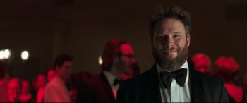 Movie still from “Long Shot” (2019), directed by Jonathan Levine – A man in a suit and a tie; Close Up shot, Over the shoulder angle