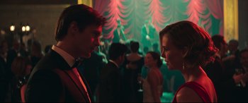 Movie still from “Long Shot” (2019), directed by Jonathan Levine – A man and a woman are talking in a room; Medium shot, Over the shoulder angle