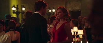 Movie still from “Long Shot” (2019), directed by Jonathan Levine – A man and a woman are talking to each other at an event; Medium shot, Over the shoulder angle
