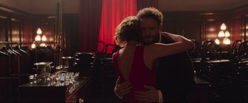 Movie still from “Long Shot” (2019), directed by Jonathan Levine – A man and a woman hugging in a room; Medium shot, Over the shoulder angle