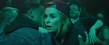 Movie still from “Long Shot” (2019), directed by Jonathan Levine – A person wearing a hat; Close Up shot, Over the shoulder angle