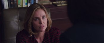 Movie still from “Long Shot” (2019), directed by Jonathan Levine – A person sitting in a chair; Close Up shot, Over the shoulder angle