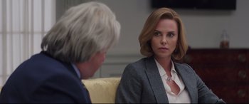 Movie still from “Long Shot” (2019), directed by Jonathan Levine – A woman sitting next to a man on a yellow couch; Close Up shot, Over the shoulder angle