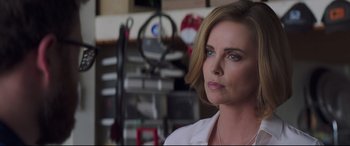 Movie still from “Long Shot” (2019), directed by Jonathan Levine – A person wearing a white shirt; Close Up shot, Over the shoulder angle