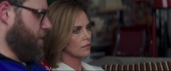 Movie still from “Long Shot” (2019), directed by Jonathan Levine – A person sitting in a room; Close Up shot, Over the shoulder angle