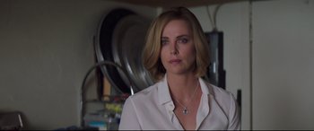 Movie still from “Long Shot” (2019), directed by Jonathan Levine – Charlize theron wearing a white shirt; Close Up shot, Over the shoulder angle
