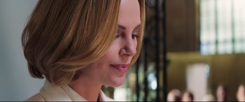 Movie still from “Long Shot” (2019), directed by Jonathan Levine – A person wearing a white shirt; Close Up shot, Over the shoulder angle