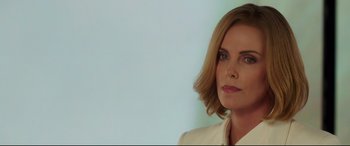 Movie still from “Long Shot” (2019), directed by Jonathan Levine – A person wearing a suit; Close Up shot, Low angle