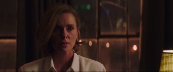 Movie still from “Long Shot” (2019), directed by Jonathan Levine – A person wearing a white shirt; Close Up shot, Over the shoulder angle