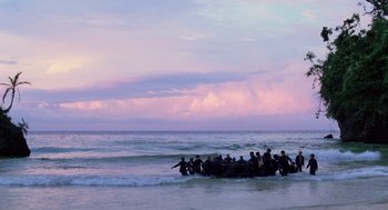 Movie still from “Lord of the Flies” (1990), directed by Harry Hook – A group of people in the ocean on a raft; Extreme Wide shot, High angle