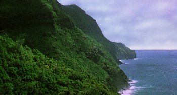 Movie still from “Lord of the Flies” (1990), directed by Harry Hook – A view of the ocean from the side of a cliff; Extreme Wide shot, High angle