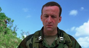 Movie still from “Lord of the Flies” (1990), directed by Harry Hook – A person wearing a uniform; Close Up shot, Low angle