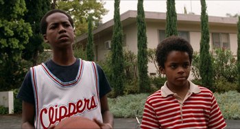 Movie still from “Love & Basketball” (2000), directed by Gina Prince-Bythewood – A couple of people standing next to each other; Close Up shot, Low angle