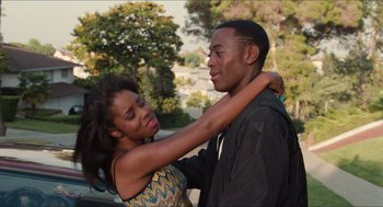 Movie still from “Love & Basketball” (2000), directed by Gina Prince-Bythewood – A man and a woman hugging each other outside; Medium shot, Over the shoulder angle