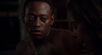 Movie still from “Love & Basketball” (2000), directed by Gina Prince-Bythewood – A person wearing a necklace; Close Up shot, Over the shoulder angle