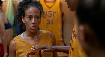 Movie still from “Love & Basketball” (2000), directed by Gina Prince-Bythewood – A group of young men standing next to each other; Close Up shot, Over the shoulder angle